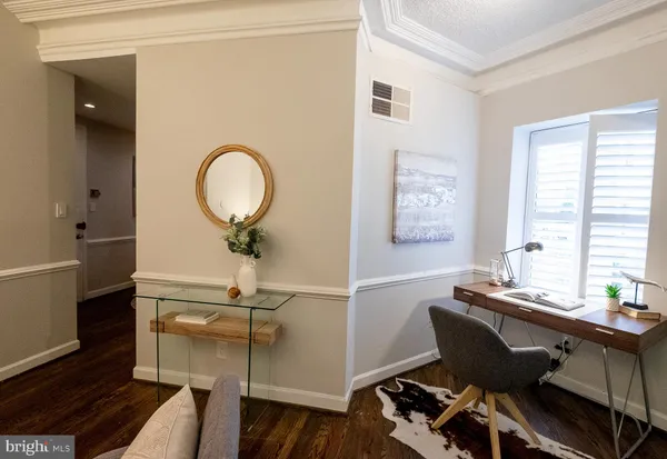 a workspace with furniture and window