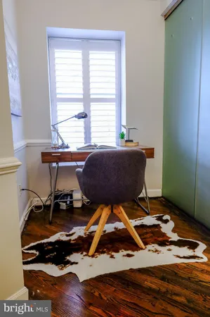 a living room with a table and a window