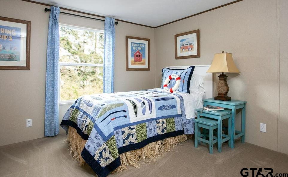 357 Oilfield Road Texarkana, TX 75501 - Photo 17 of 20 a bedroom with a bed and a window