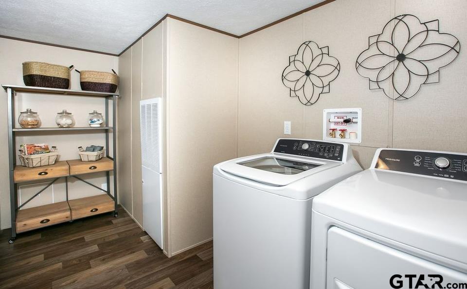 357 Oilfield Road Texarkana, TX 75501 - Photo 20 of 20 a view of storage and utility room with washer and dryer