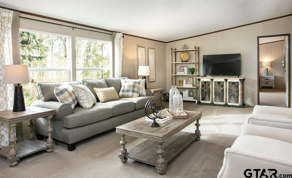 357 Oilfield Road Texarkana, TX 75501 - Photo 2 of 20 a living room with furniture and a flat screen tv