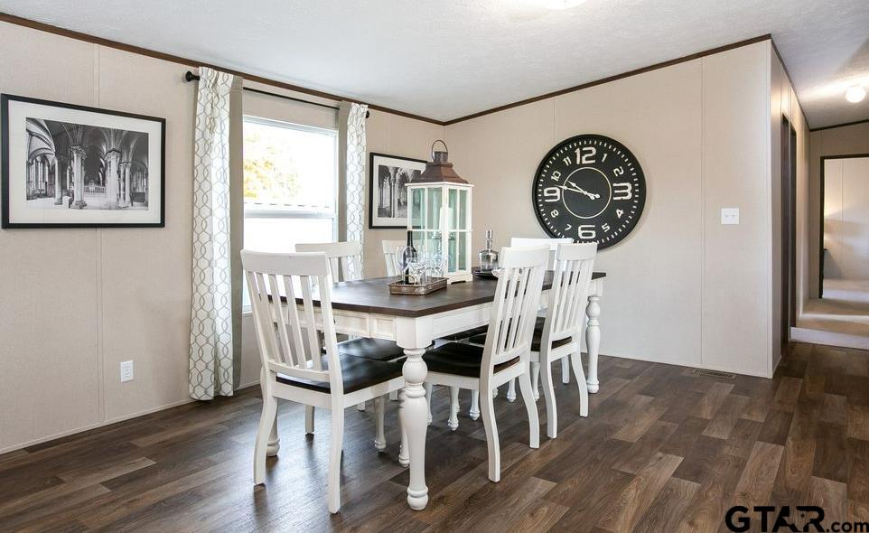 357 Oilfield Road Texarkana, TX 75501 - Photo 5 of 20 a view of a dining room with furniture and wooden floor