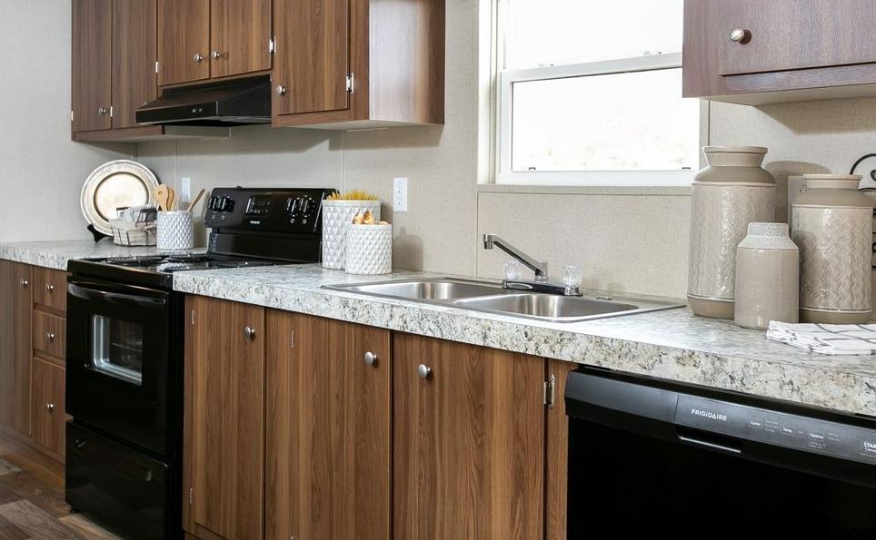 357 Oilfield Road Texarkana, TX 75501 - Photo 7 of 20 a kitchen with granite countertop a sink a stove and cabinets