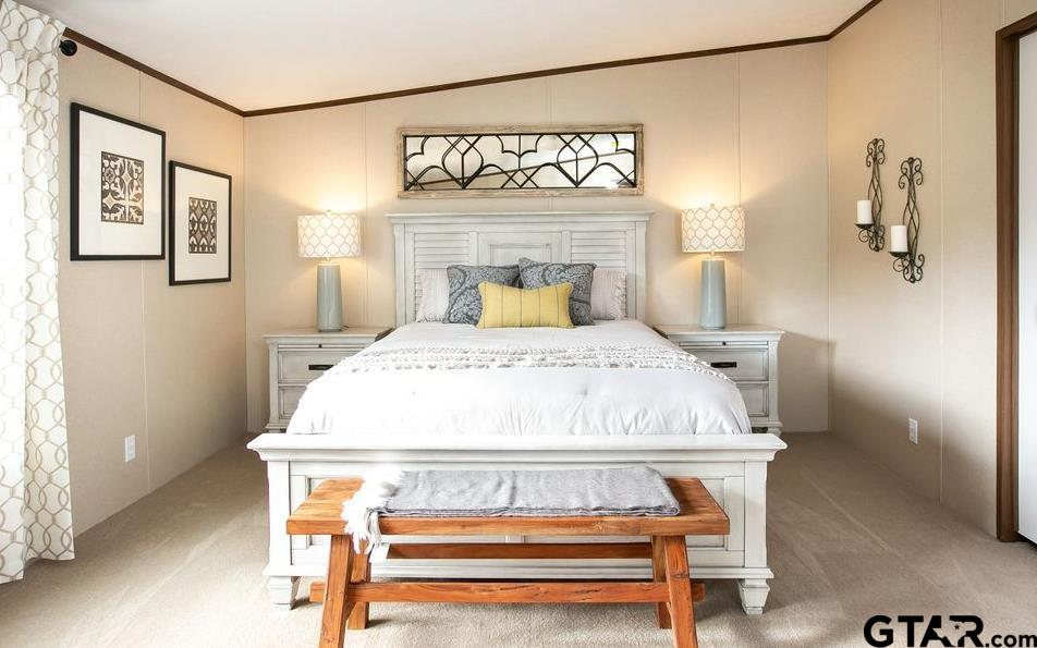 357 Oilfield Road Texarkana, TX 75501 - Photo 9 of 20 a bed sitting in a bedroom next to a window