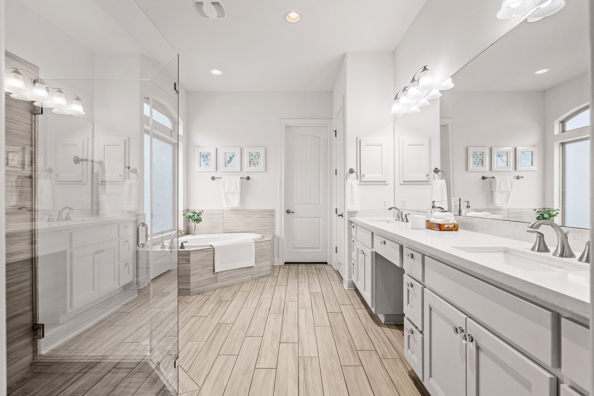 4609 Gallego Circle Austin, TX 78738 - Photo 12 of 40 Primary Bathroom featuring a bath, double vanity, a shower stall, plenty of natural light, and recessed lighting