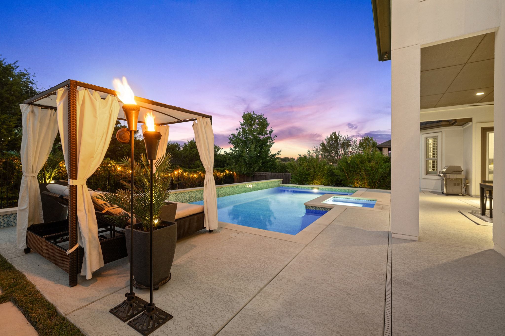 4609 Gallego Circle Austin, TX 78738 - Photo 31 of 40 Retreat-style space featuring a pool and spa with a patio, including a plumbed-in gas line for a grill, surrounded by abundant privacy landscaping.