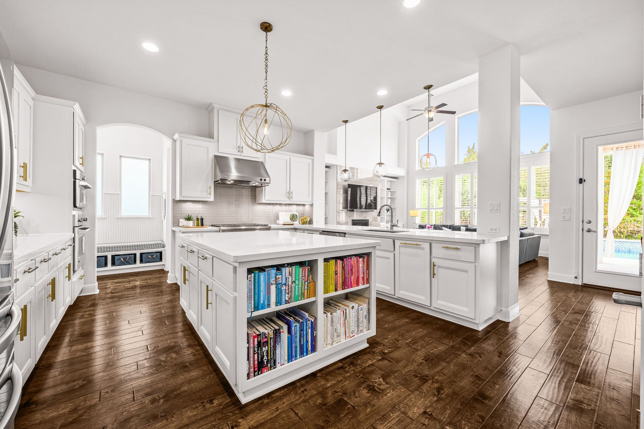 4609 Gallego Circle Austin, TX 78738 - Photo 5 of 40 Kitchen featuring a peninsula, white cabinets, a kitchen island, dark wood finished floors, and recessed lighting