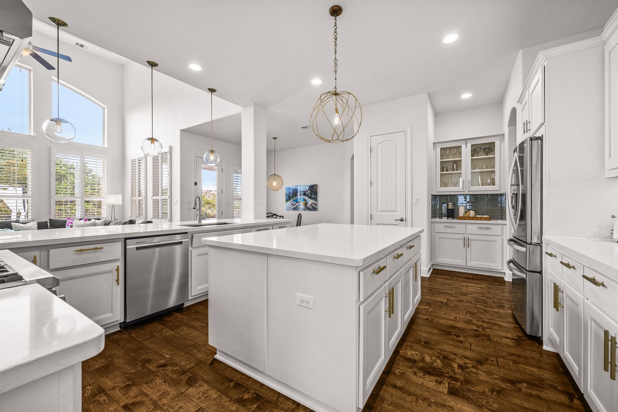 4609 Gallego Circle Austin, TX 78738 - Photo 39 of 40 Kitchen featuring white cabinets, open floor plan, dark wood-type flooring, and recessed lighting