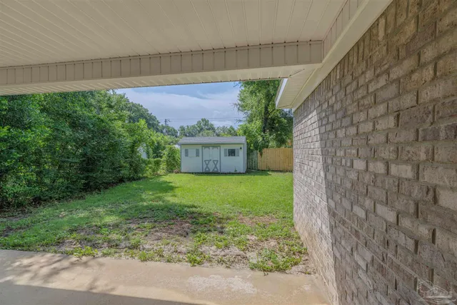 a view of a back yard of the house