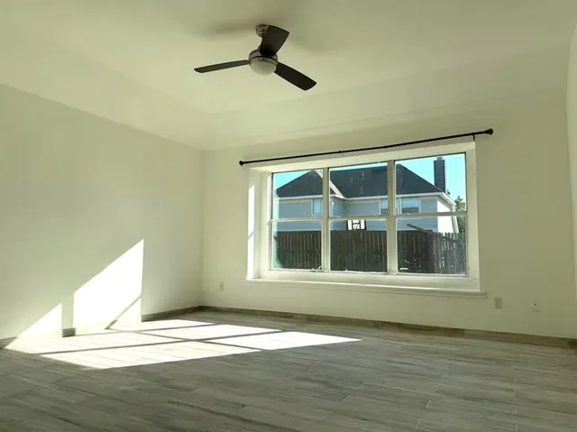a view of a kitchen with an empty space and a window