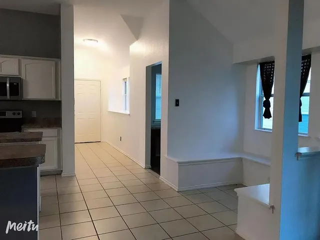 a view of a hallway view with staircase