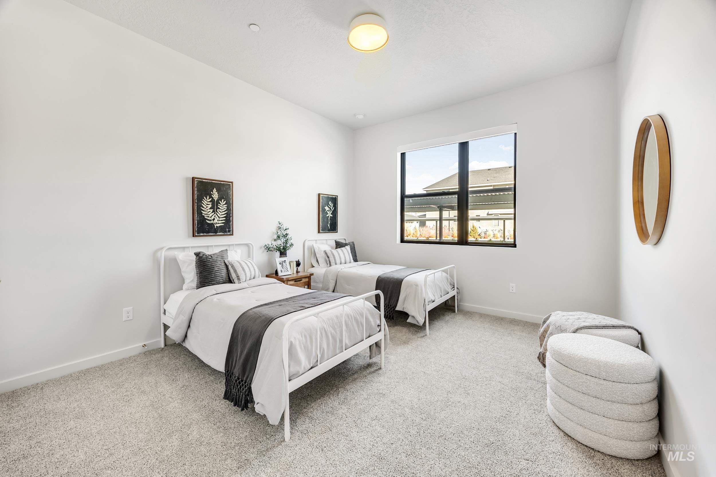 4340 East Haystack Street, Unit 104 Boise, ID 83716 - Photo 19 of 50 Bedroom featuring light carpet and baseboards
