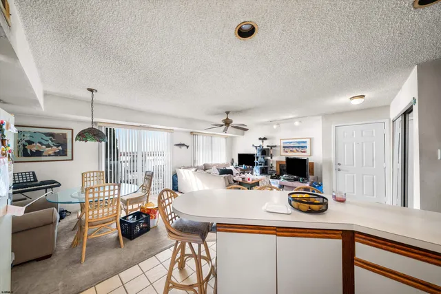 a kitchen view with table and chairs