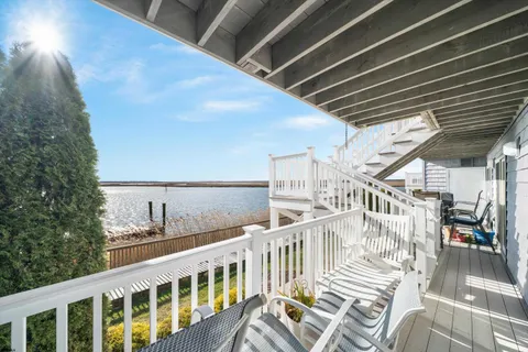 a view of balcony with furniture