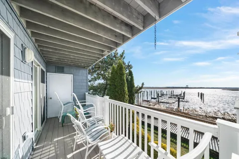 a view of balcony with furniture