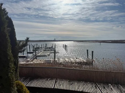 a view of a balcony with wooden floor