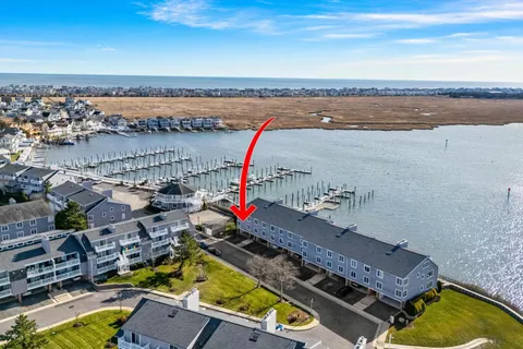an aerial view of a house with a swimming pool