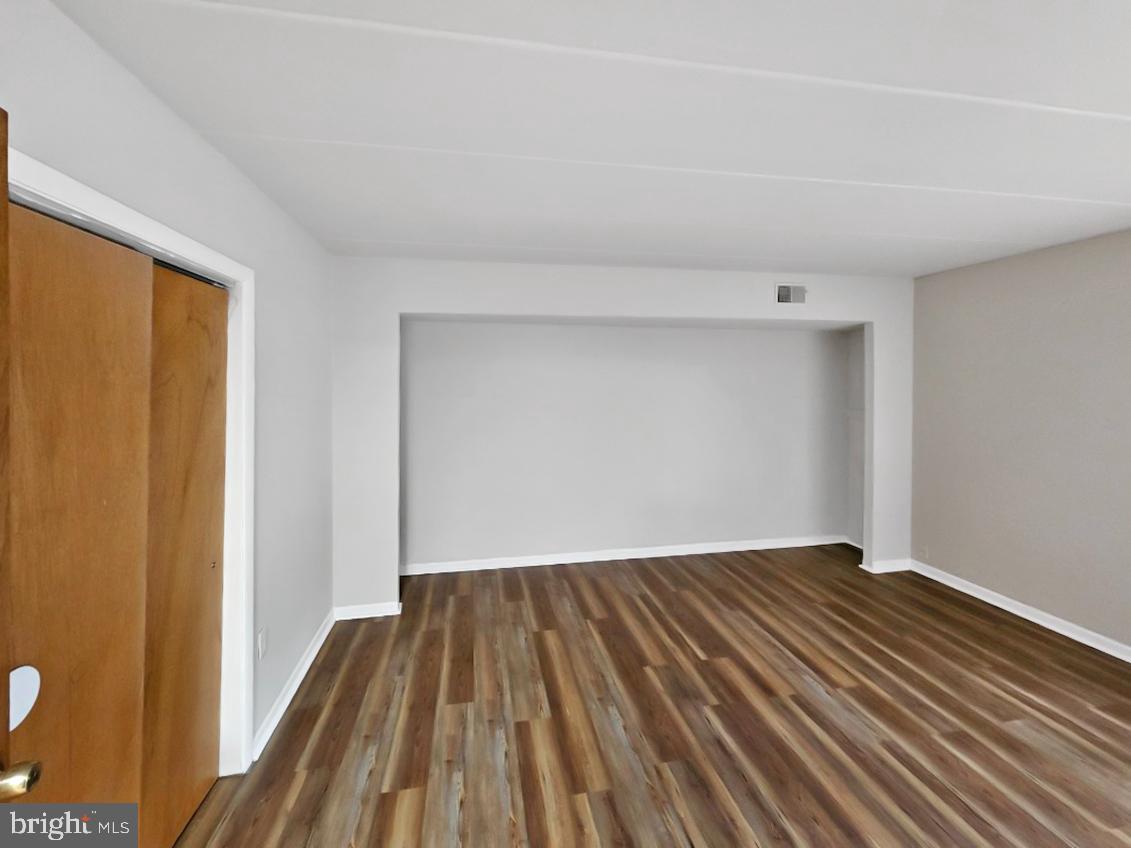 233 Township Line Road, Unit 2A Elkins Park, PA 19027 - Photo 14 of 24 a view of a room with wooden floor and bench