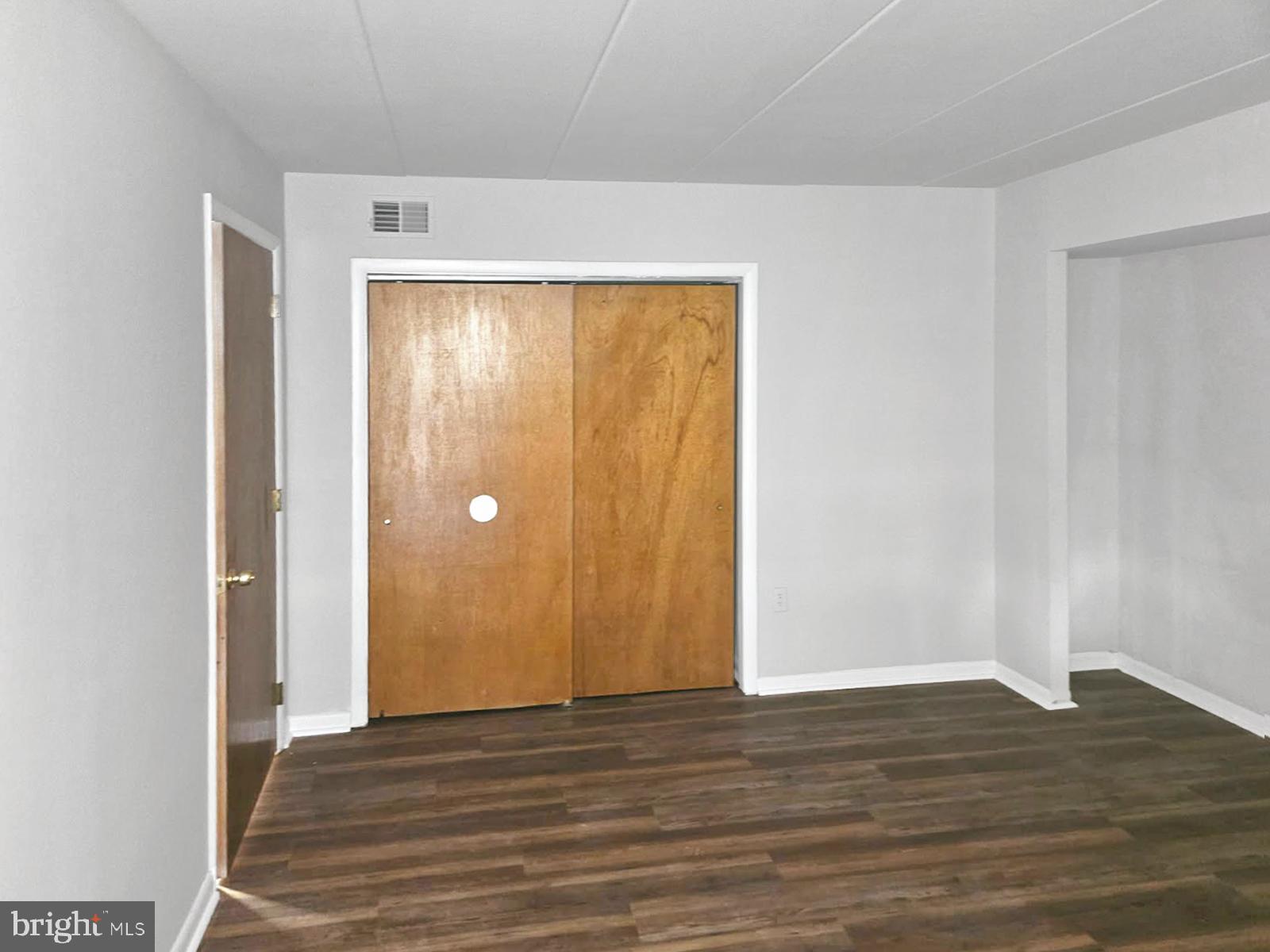 233 Township Line Road, Unit 2A Elkins Park, PA 19027 - Photo 16 of 24 a view of an empty room with wooden floor