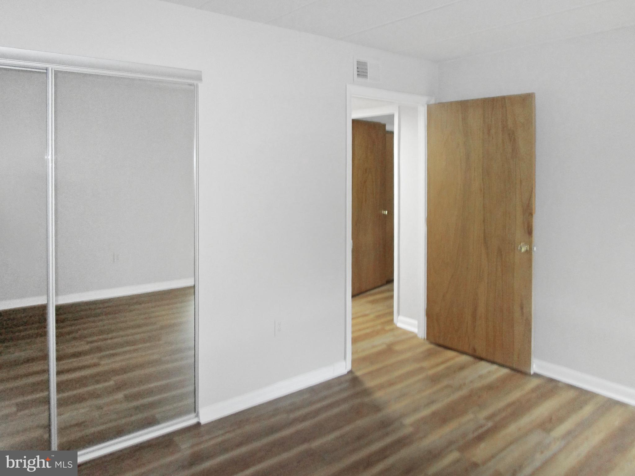 233 Township Line Road, Unit 2A Elkins Park, PA 19027 - Photo 18 of 24 a view of hallway with wooden floor