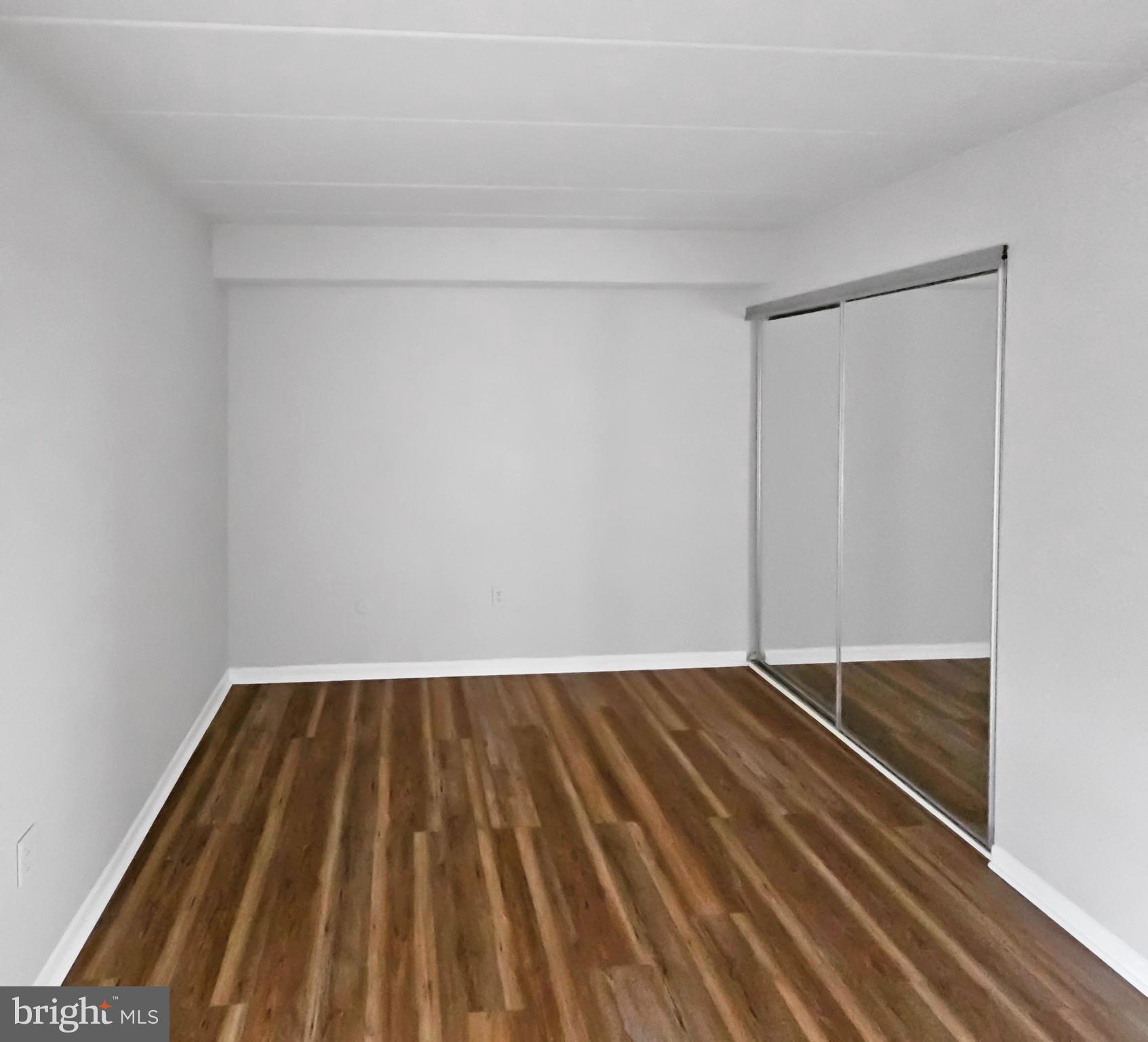 233 Township Line Road, Unit 2A Elkins Park, PA 19027 - Photo 19 of 24 a view of wooden floor in a room
