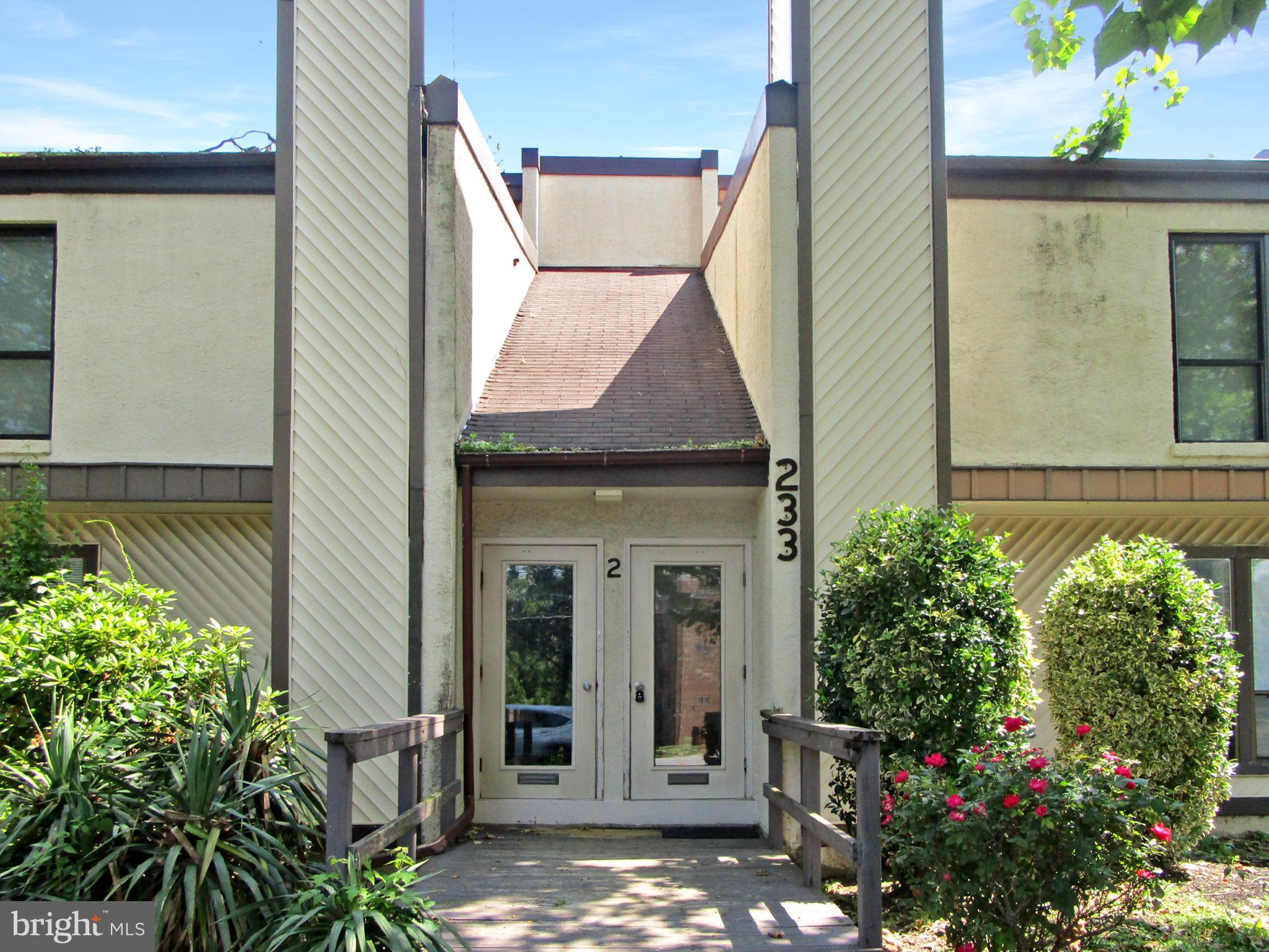 233 Township Line Road, Unit 2A Elkins Park, PA 19027 - Photo 2 of 24 a view of a house with potted plants