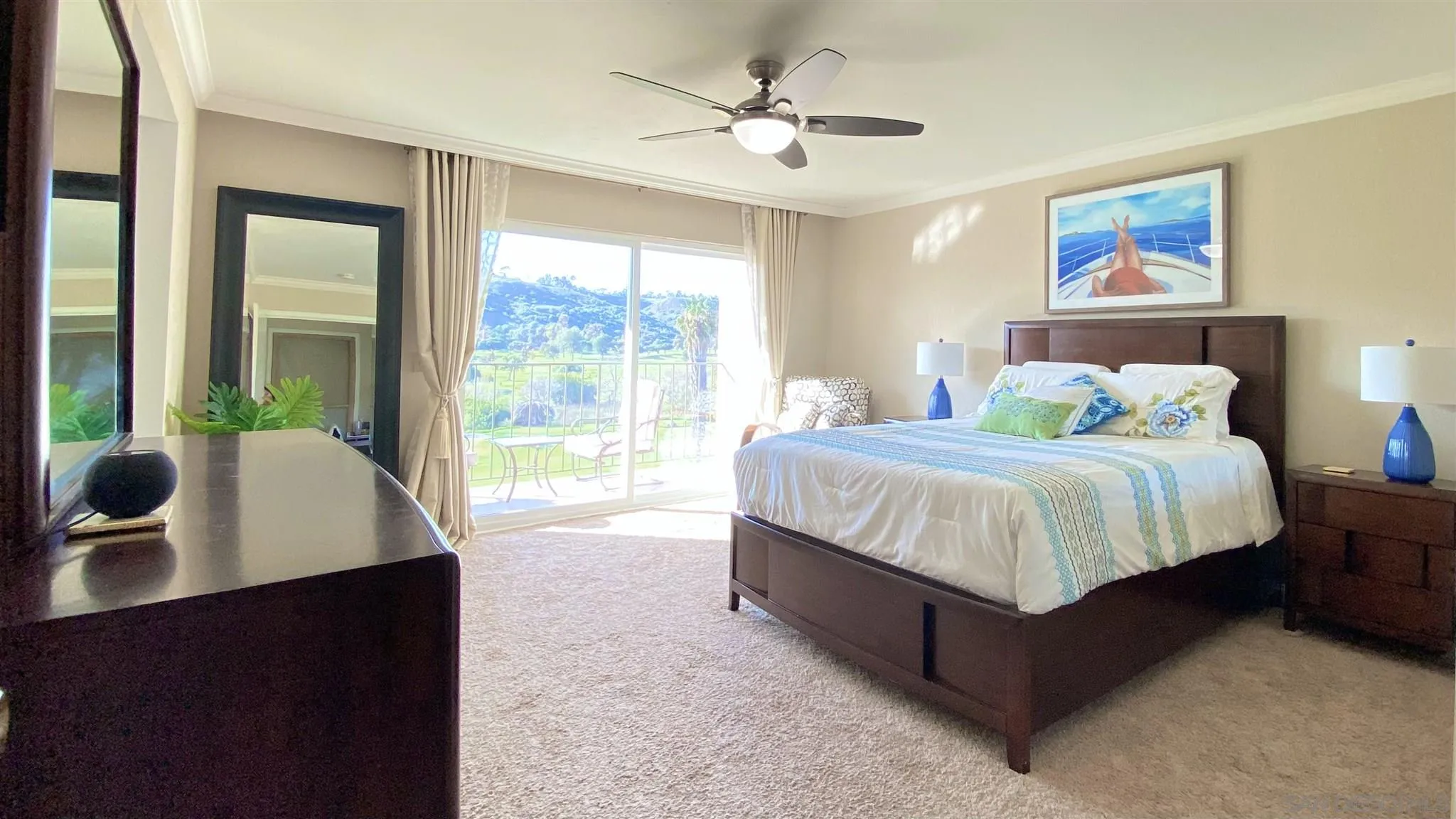 6780 Mission Gorge Road, Unit 30 San Diego, CA 92120 - Photo 11 of 24 a bedroom with a large bed and a window