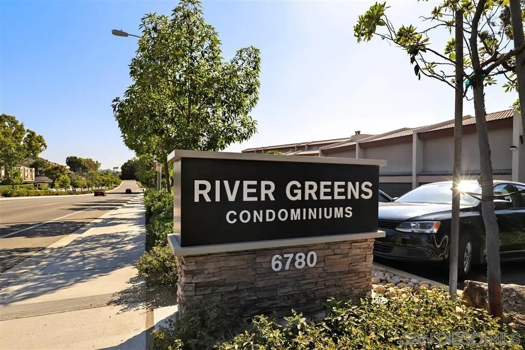 6780 Mission Gorge Road, Unit 30 San Diego, CA 92120 - Photo 23 of 24 a view of a street sign under a large tree