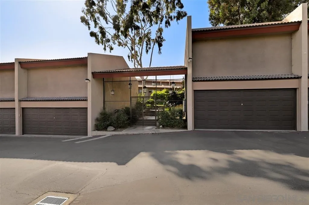 6780 Mission Gorge Road, Unit 30 San Diego, CA 92120 - Photo 24 of 24 a front view of a house with a garage