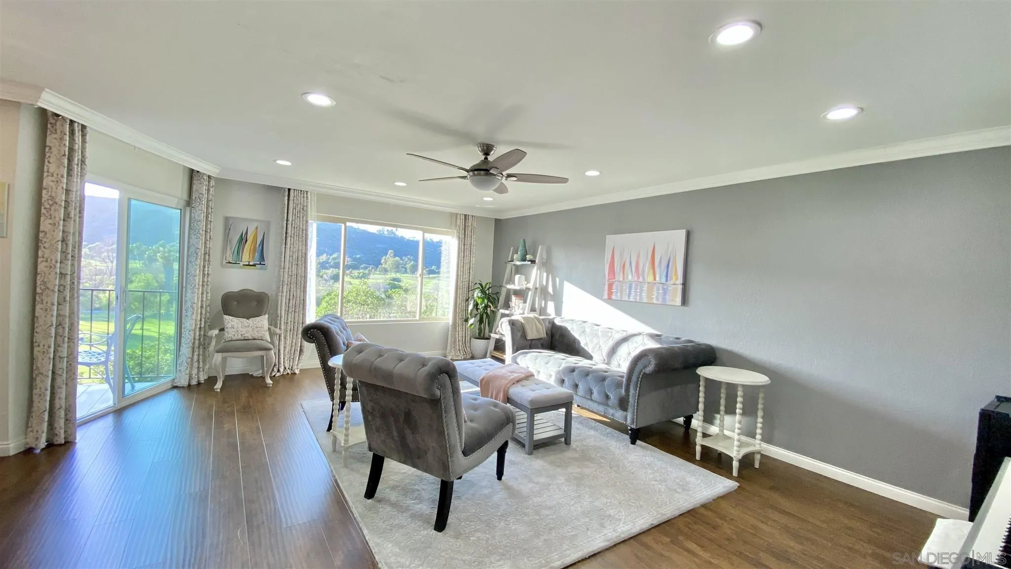 6780 Mission Gorge Road, Unit 30 San Diego, CA 92120 - Photo 6 of 24 a living room with furniture two window and wooden floor