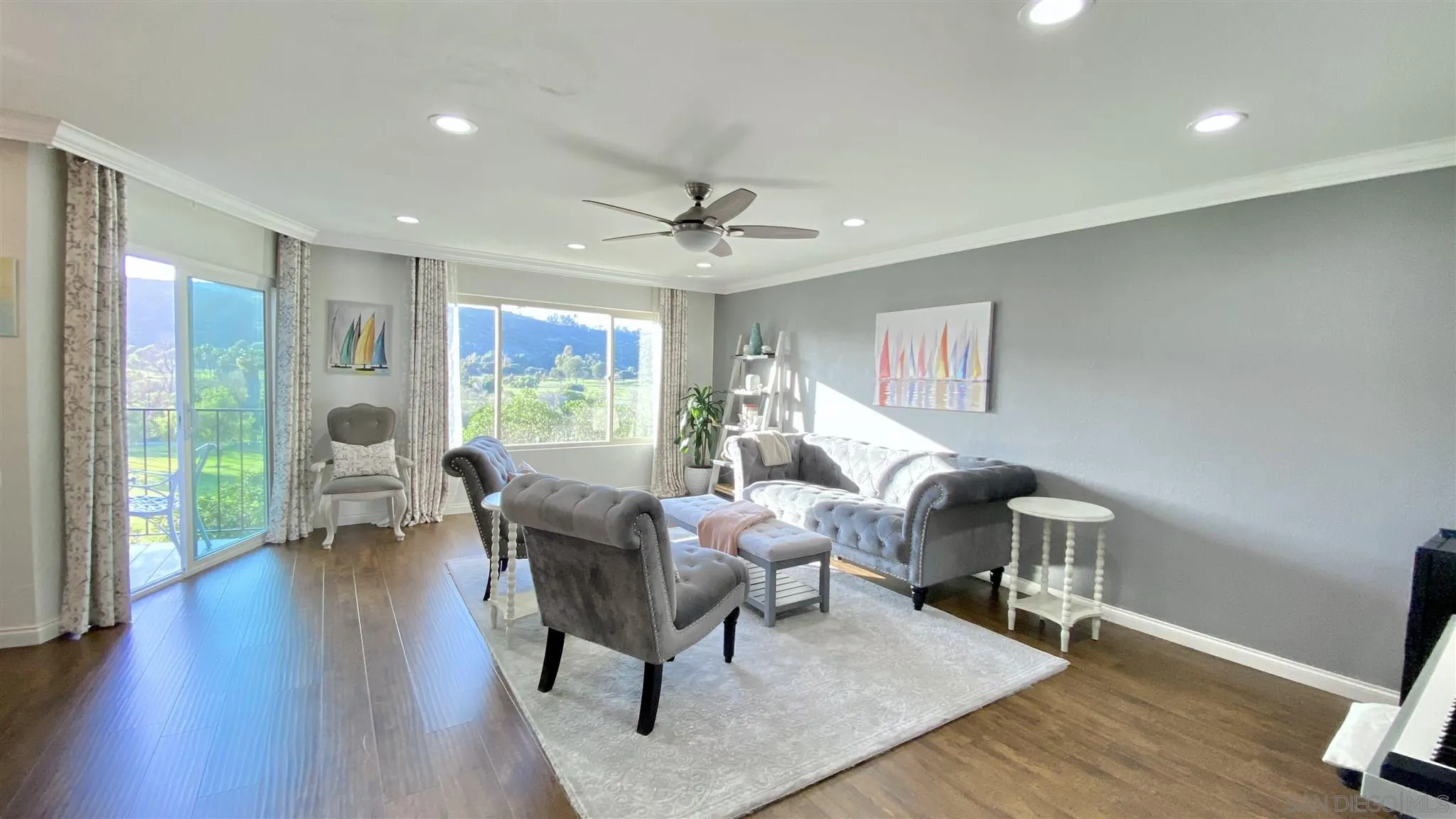 6780 Mission Gorge Road, Unit 30 San Diego, CA 92120 - Photo 7 of 24 a living room with furniture two window and wooden floor