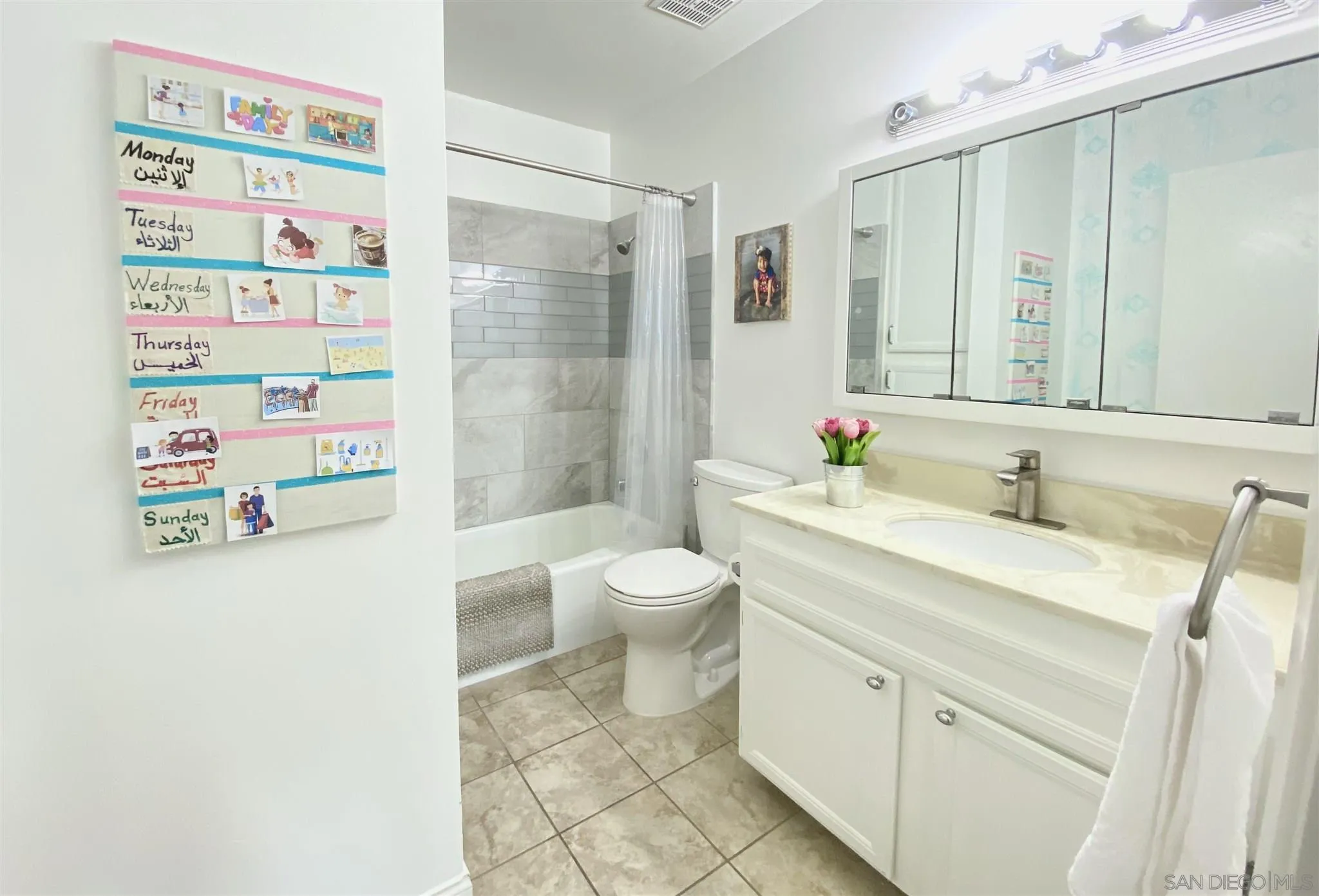6780 Mission Gorge Road, Unit 30 San Diego, CA 92120 - Photo 10 of 24 a spacious bathroom with a shower sink vanity mirror and toilet