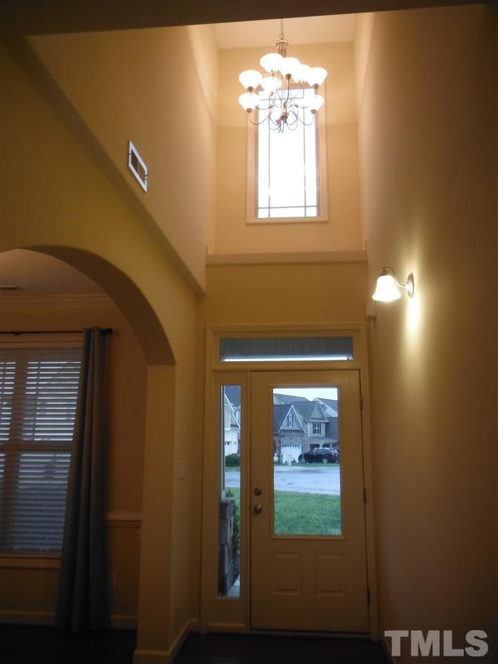 2 Story Entry with Decorative Ledge & Beautiful Fixture