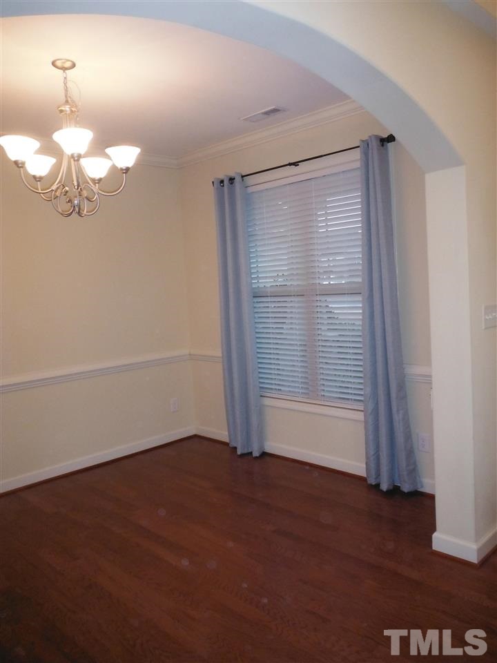 Dining Room with hardwood floors, Molding, Natural Light