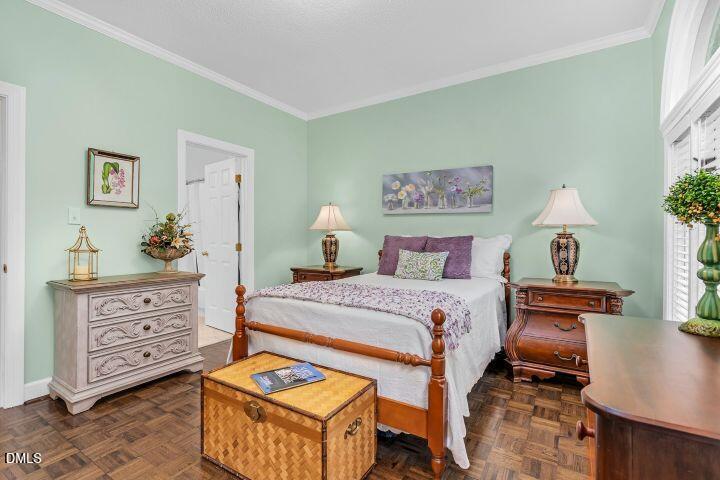 1311 Forest Hills Road Northwest, Unit D2 Wilson, NC 27896 - Photo 27 of 31 a bedroom with a bed and a dresser in it