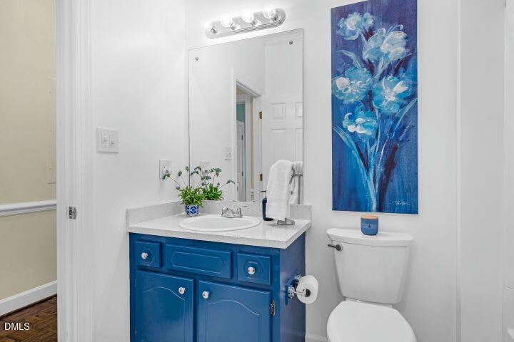 1311 Forest Hills Road Northwest, Unit D2 Wilson, NC 27896 - Photo 28 of 31 a bathroom with a toilet a sink and a mirror