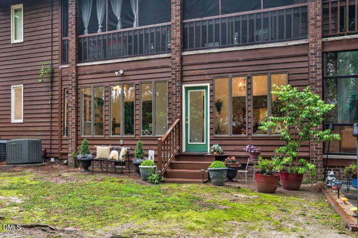 1311 Forest Hills Road Northwest, Unit D2 Wilson, NC 27896 - Photo 30 of 31 a view of a two chair in the patio
