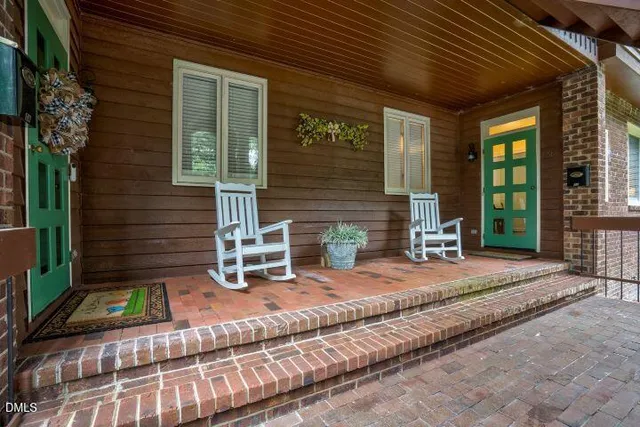 a backyard of a house with seating space