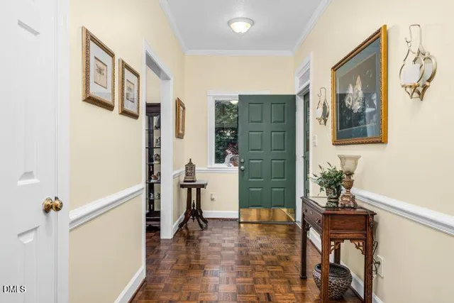 a view of an entryway with wooden floor