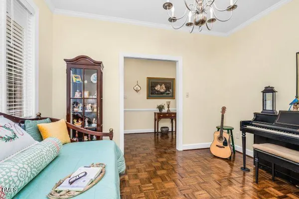 a living room with furniture and a piano