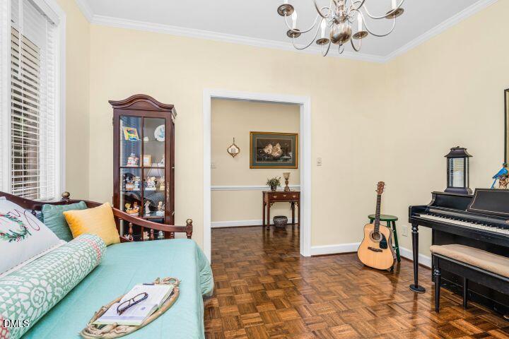 1311 Forest Hills Road Northwest, Unit D2 Wilson, NC 27896 - Photo 7 of 31 a living room with furniture and a piano
