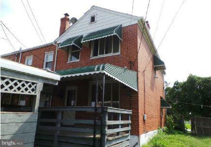 3496 Dunhaven Road Baltimore, MD 21222 - Photo 2 of 10 a front view of a house with a yard