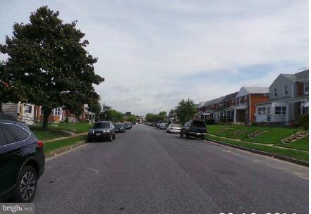 3496 Dunhaven Road Baltimore, MD 21222 - Photo 3 of 10 a view of a street with a car parked in front of it