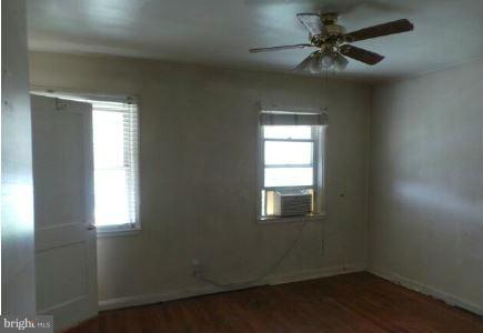 3496 Dunhaven Road Baltimore, MD 21222 - Photo 4 of 10 an empty room that has a window