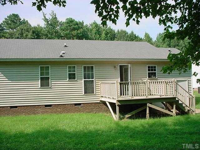 5928 Sandy Raleigh, NC 27610 - Photo 2 of 3 a backyard of a house with deck and garden
