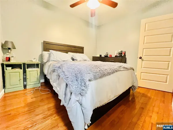 a bed room with a bed and a night stand