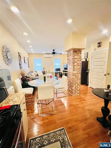 a living room with furniture and a rug
