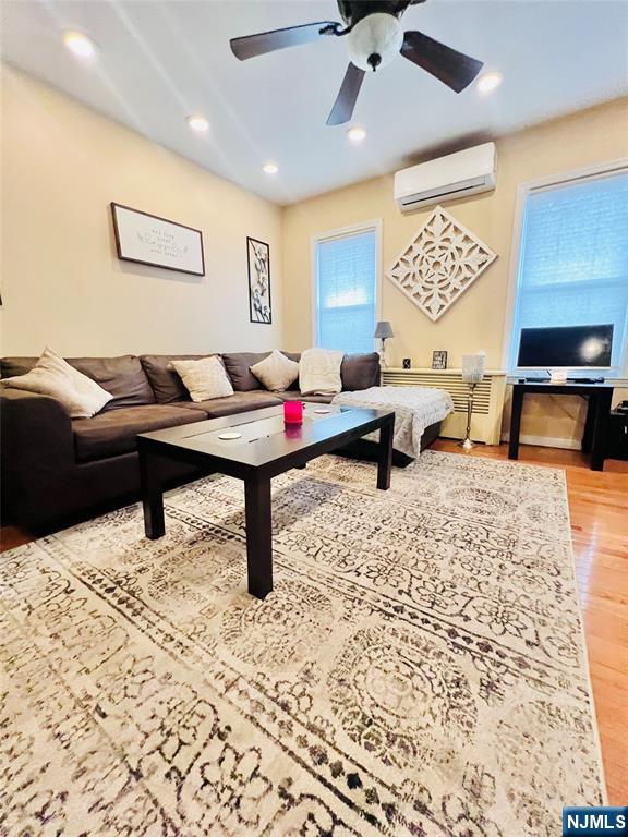 155 Ford Street Wayne, NJ 07470 - Photo 4 of 14 a living room with furniture and a couch