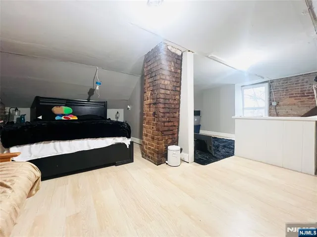 a bedroom with a bed and a cabinets