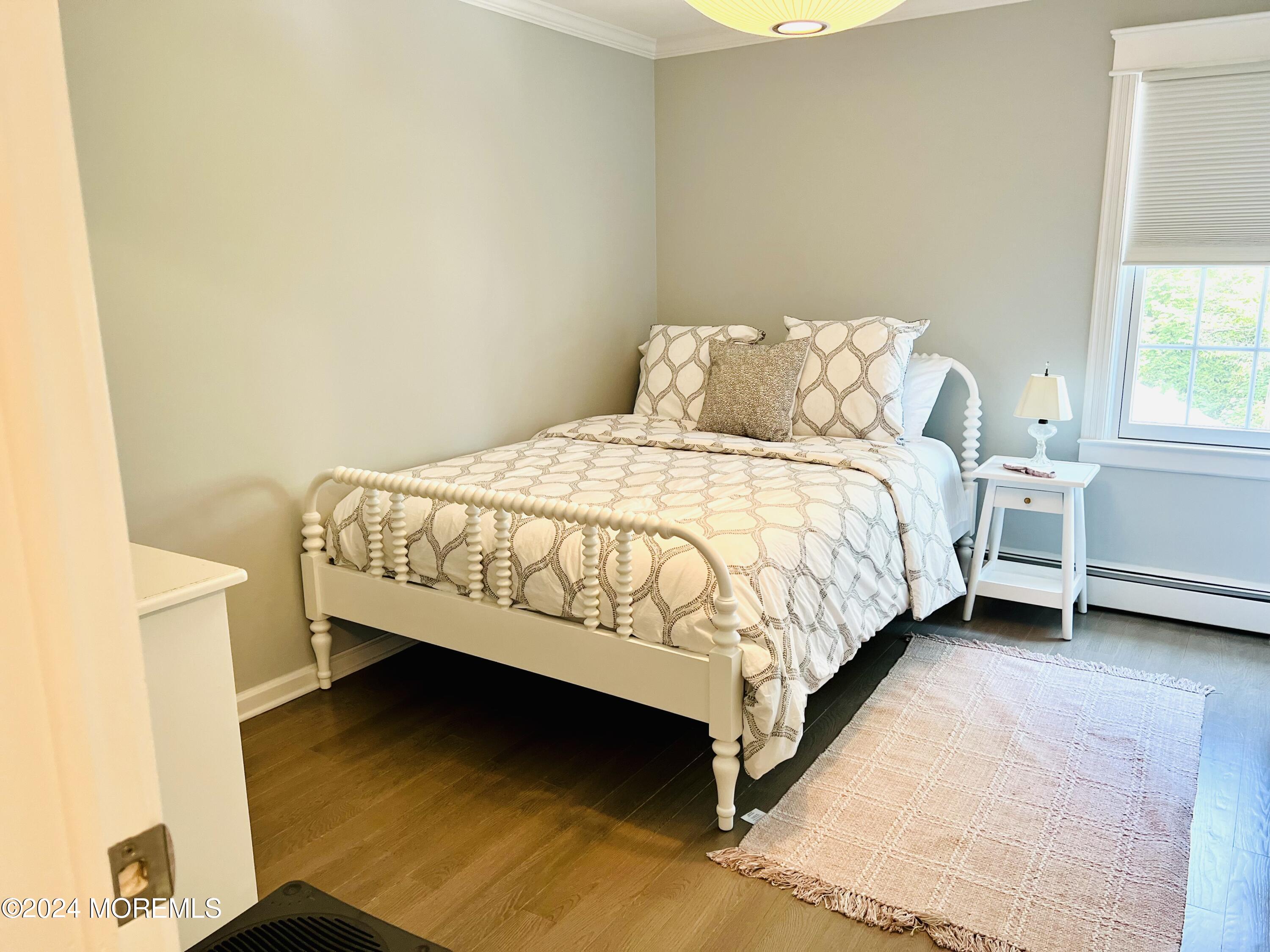 2122 Edgewood Place Spring Lake, NJ 07762 - Photo 14 of 23 a bed sitting in a bedroom next to a window